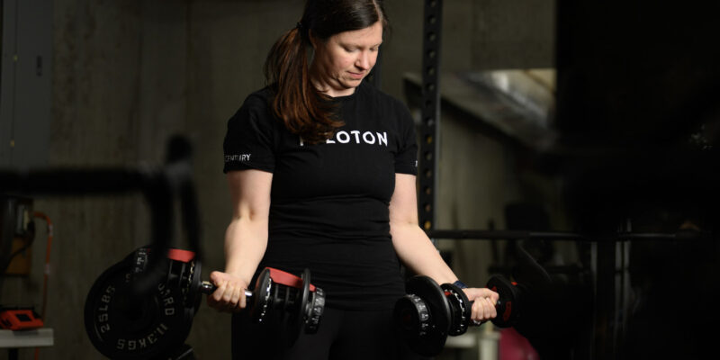 Stacy With Weights and Peloton Shirt