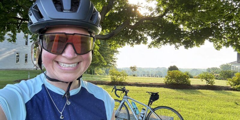 Photo of me with my bike and a view